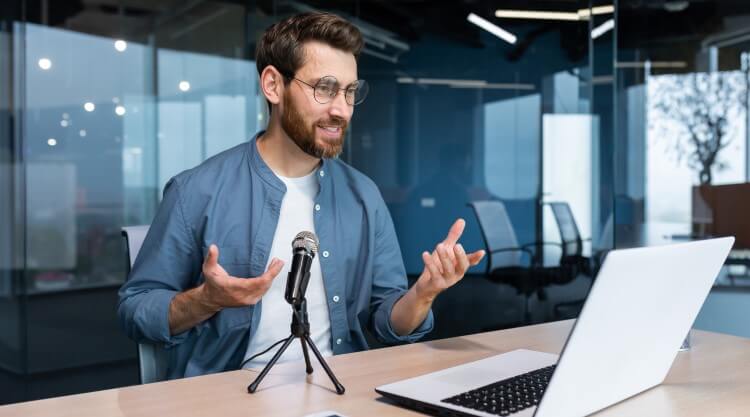 Person sitting at laptop making a video interview for a job