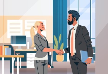 man and woman shaking hands after interview in office