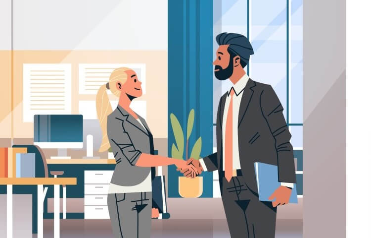 Man and woman shaking hands in an office after a job interview